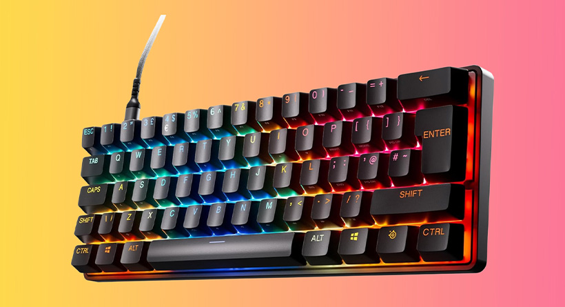 Rainbow RGB mechanical keyboard with a braided cable on a yellow-pink gradient background.