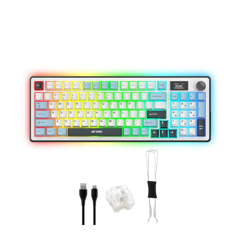 Rainbow-lit gaming keyboard with USB cable, extra white keycaps, and a keycap puller accessory present nearby.