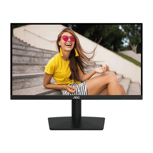 Widescreen monitor on a stand displaying a photo of a smiling woman in a yellow shirt sitting on outdoor stairs.