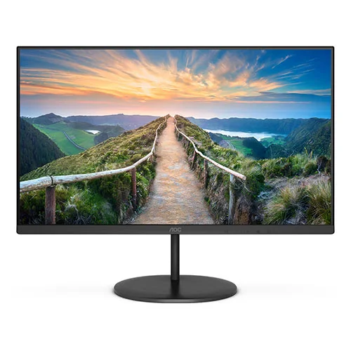 Black AOC computer monitor on a round stand displaying a scenic landscape of a hilltop path at sunset.